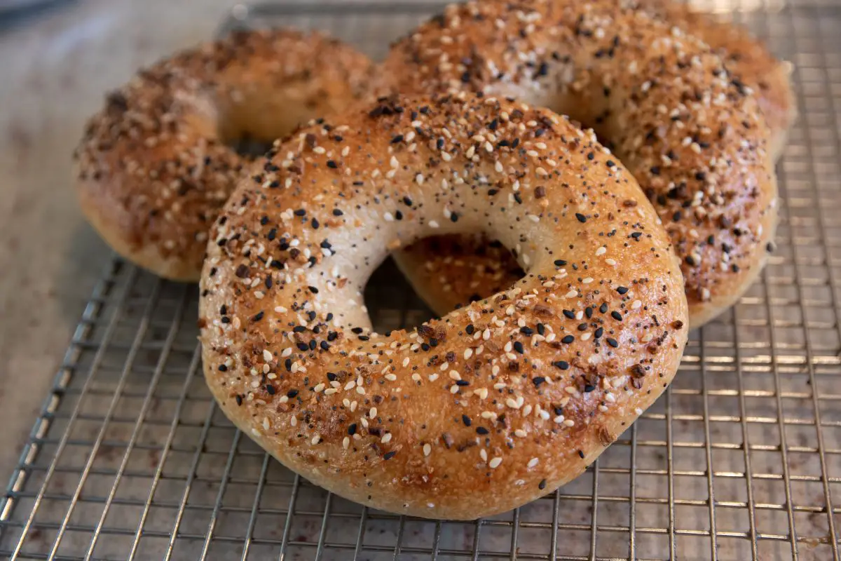 Gluten free bagels on a cooling rack.